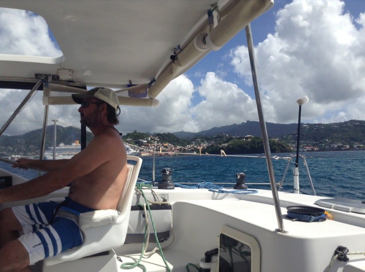 Captain in helm, sailin get, St Georges, Grenada