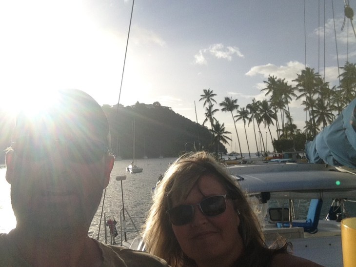 Couple, blonde, windswept, Palm trees, smiling, sunny, Caribbean 