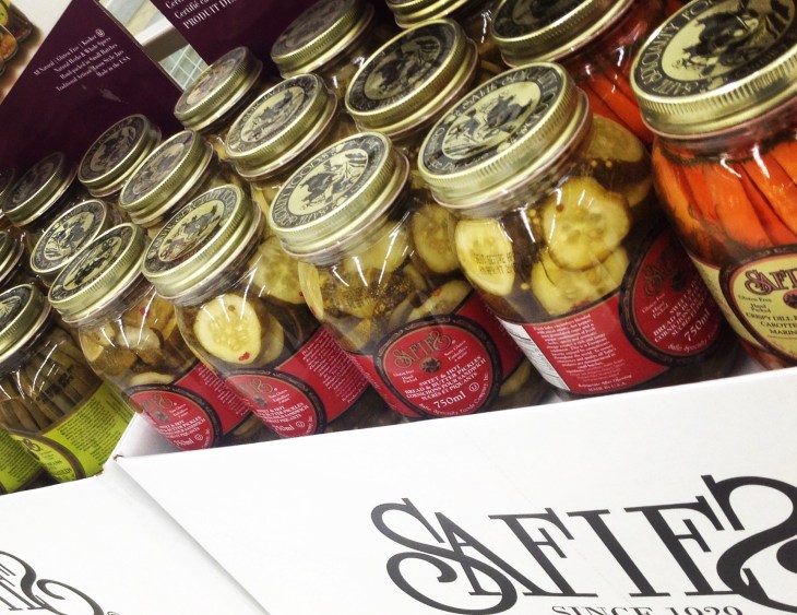 Jarred pickles, grocery store stand