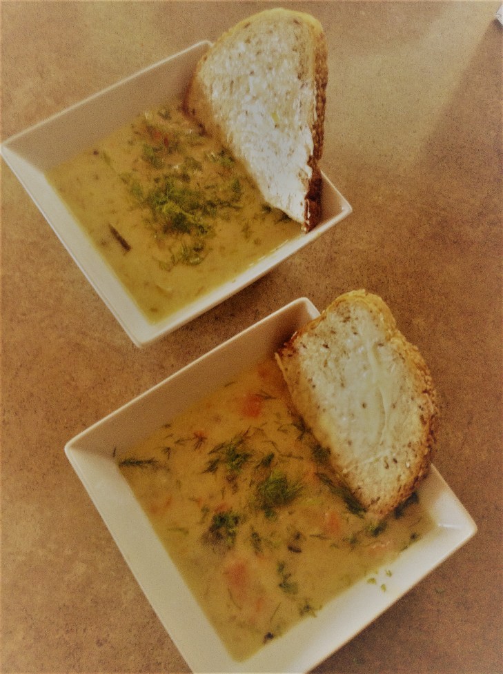 homemade pickle soup served with rye bread and dill
